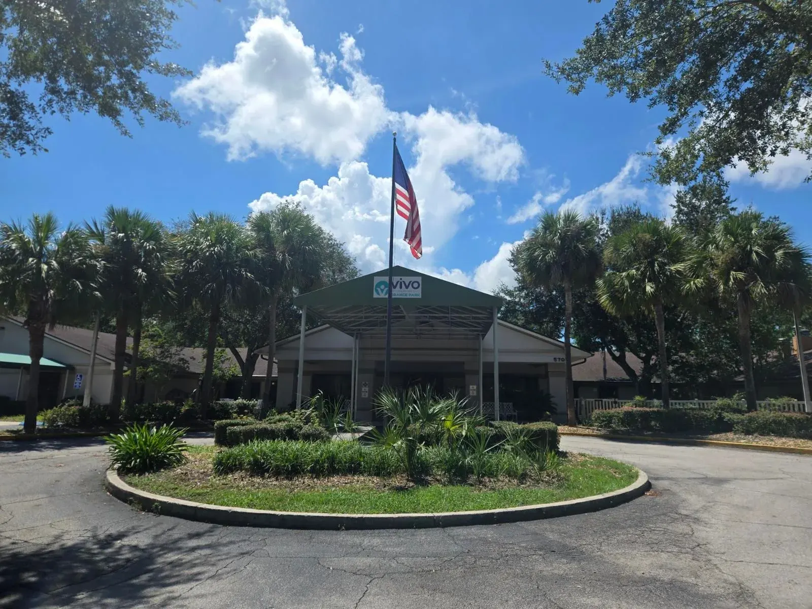 The front entrance of Vivo Healthcare Orange Park, flag flying over the drive